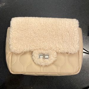 Beautiful new purse/crossbody. Brand new never used. Silver colored hardware.